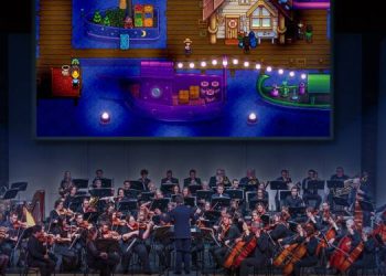 Musicians rehearsing for Stardew Valley Symphony under ConcernedApe's direction