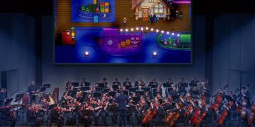 Musicians rehearsing for Stardew Valley Symphony under ConcernedApe's direction