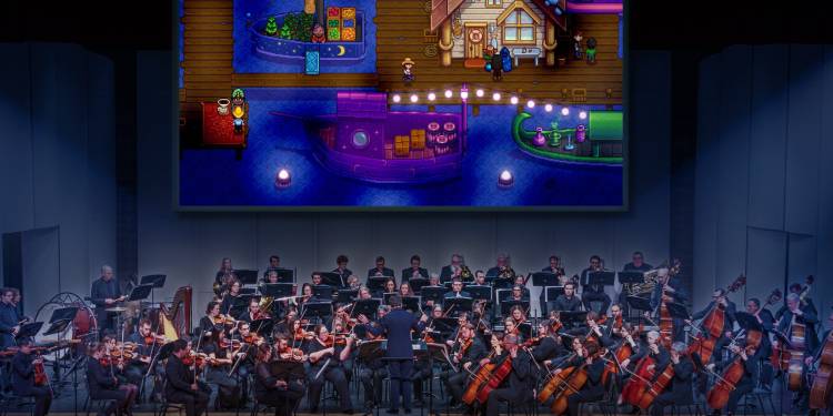 Musicians rehearsing for Stardew Valley Symphony under ConcernedApe's direction